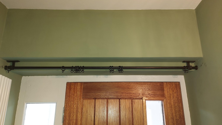 A recess pole above a door