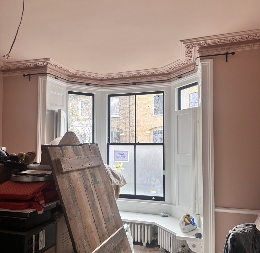 Bay window curtain pole with Flared Ball finials with a Beeswax finish.